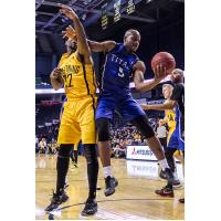 Kitchener-Waterloo Titans SG/SF Tramar Sutherland battles for the ball against the London Lightning