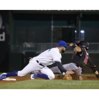 Rylan Sandoval of the Rockland Boulders tags out a New Jersey Jackals player attempting to steal