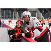 Belleville Senators left wing Vitaly Abramov poses with a young fan