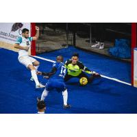 Kansas City Comets forward Leo Gibson eyes a loose ball in front of the St. Louis Ambush goal
