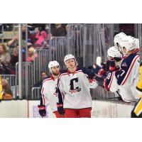 Cleveland Monsters exchange congratulations along the bench